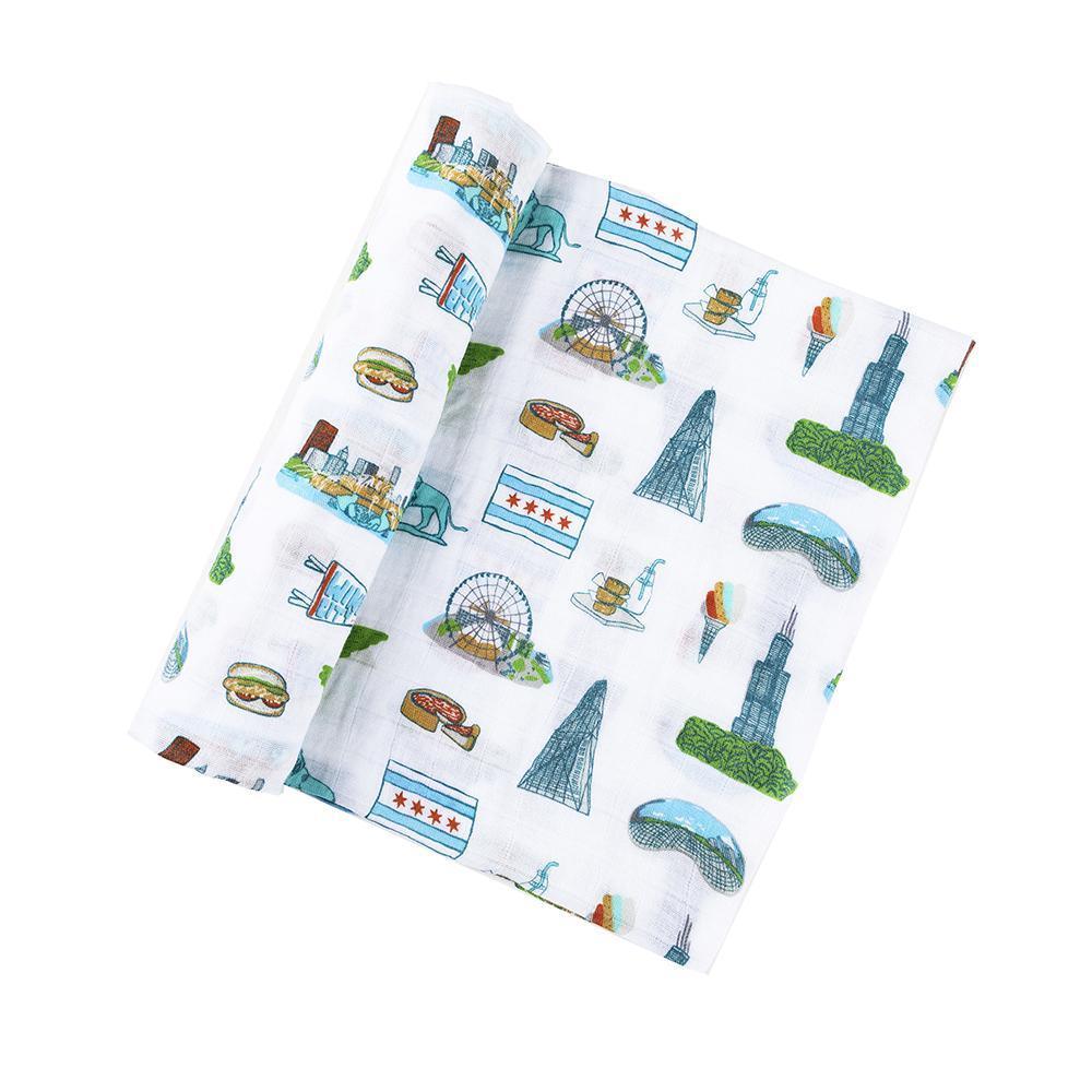 Chicago-themed baby muslin swaddle blanket featuring iconic landmarks and symbols in soft pastel colors.