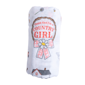 Country-themed baby gift set with a swaddle blanket and burp bib featuring farm animals and floral patterns.