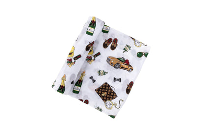 Baby swaddle blanket with a playful pattern of bow ties, mustaches, and glasses on a white background.