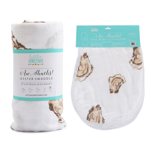 Baby gift set featuring an oyster-themed muslin swaddle blanket and burp cloth/bib combo with playful illustrations.