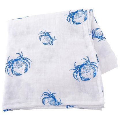 Blue crab-themed baby muslin swaddle blanket and burp cloth set, featuring playful crab illustrations on white fabric.