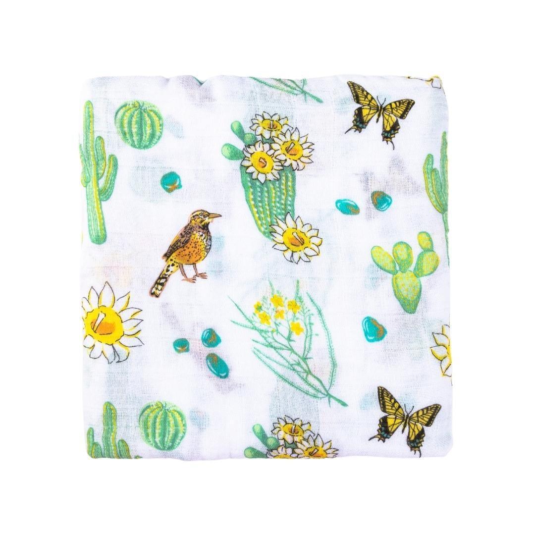 Cactus-themed baby muslin swaddle blanket and burp bib set, featuring vibrant green cacti on a white background.