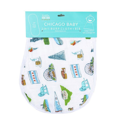 Chicago-themed baby gift set with muslin swaddle blanket, burp cloth, and bib featuring city landmarks and icons.