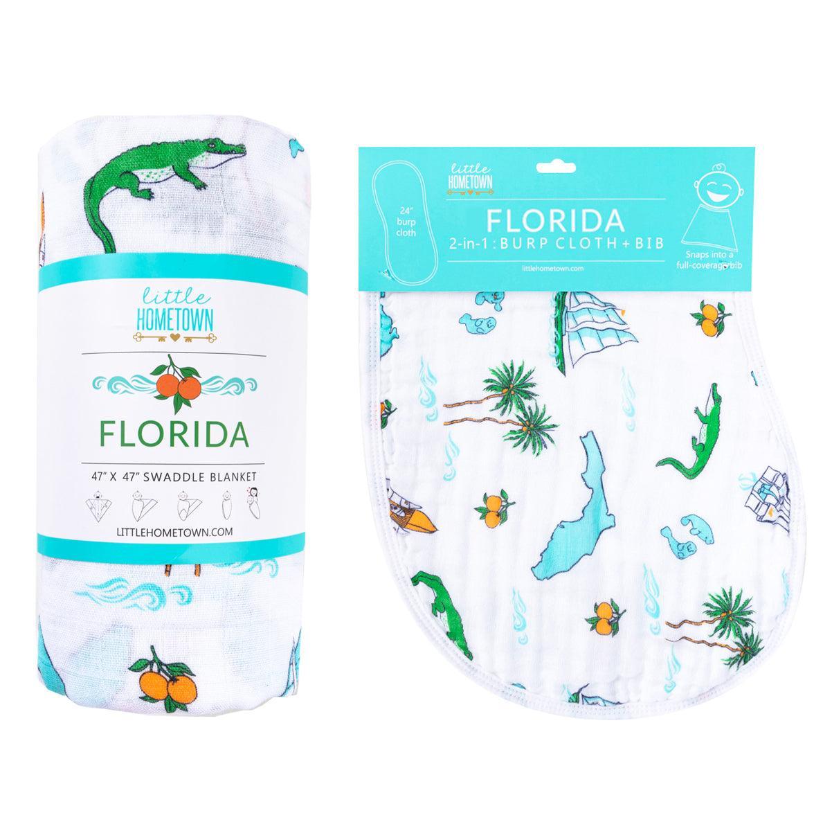 Florida-themed baby gift set with muslin swaddle blanket and burp cloth, featuring orange and green citrus prints.