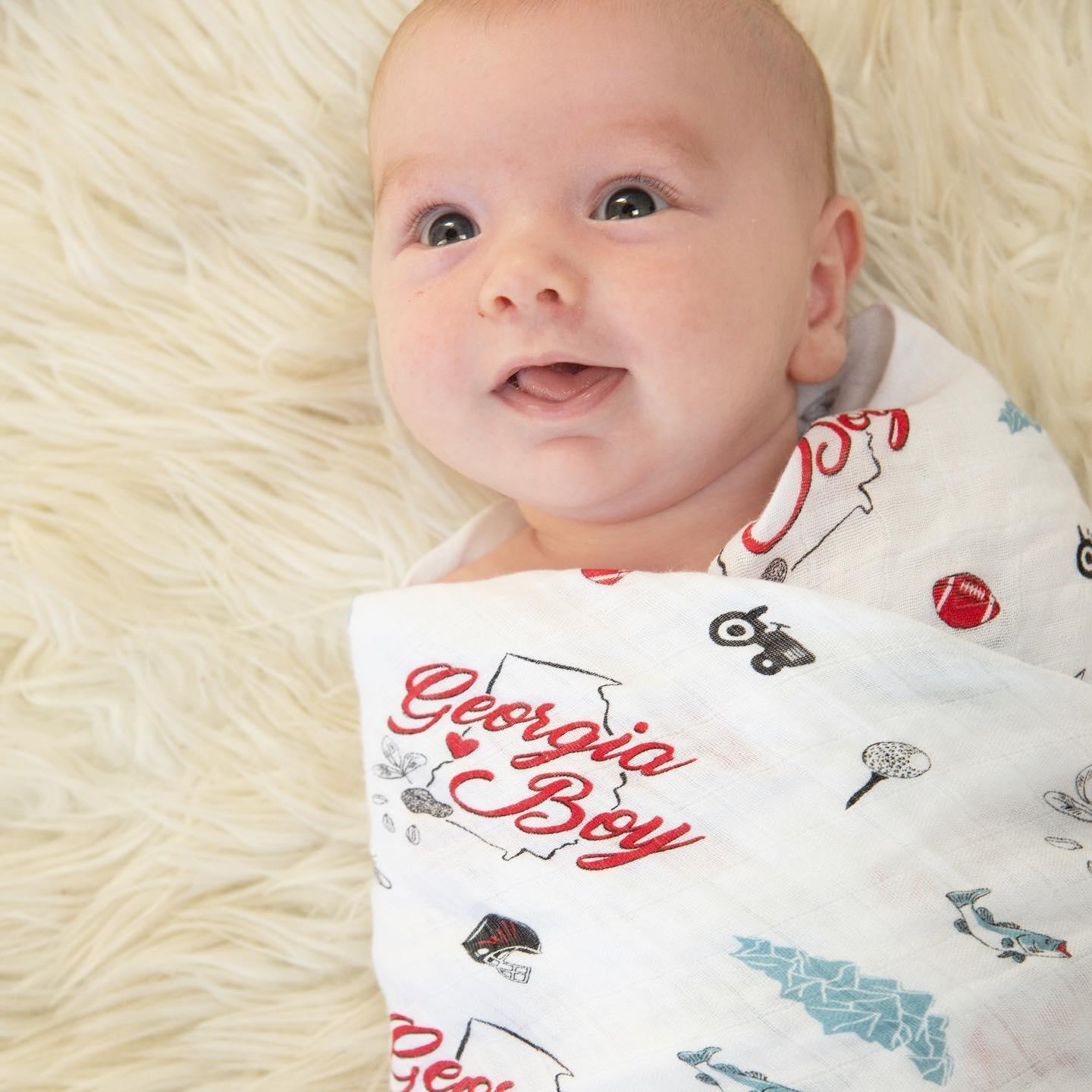 Gift set featuring a Georgia Boy muslin swaddle blanket and burp cloth/bib combo with state-themed designs.