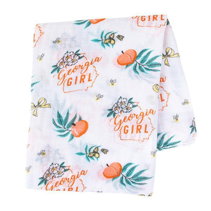 Gift set with a Georgia-themed muslin swaddle blanket and burp cloth/bib combo, featuring peach and state motifs.