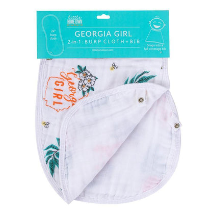 Gift set with "Georgia Girl" muslin swaddle blanket and burp cloth/bib combo, featuring peach and floral designs.