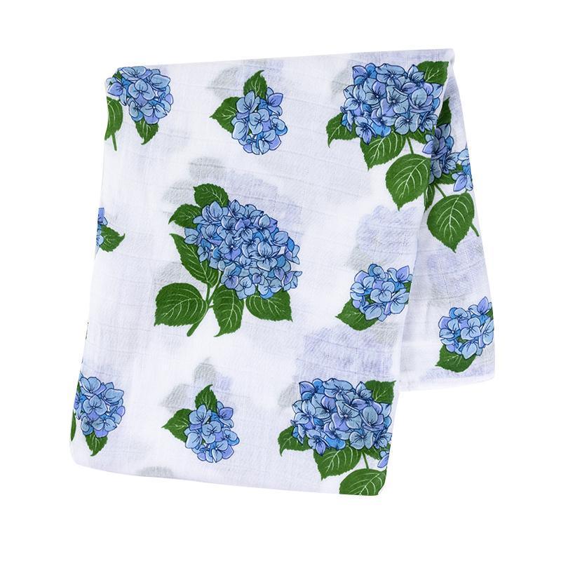 Hydrangea-themed baby muslin swaddle blanket and burp cloth set, featuring delicate blue and pink floral patterns.