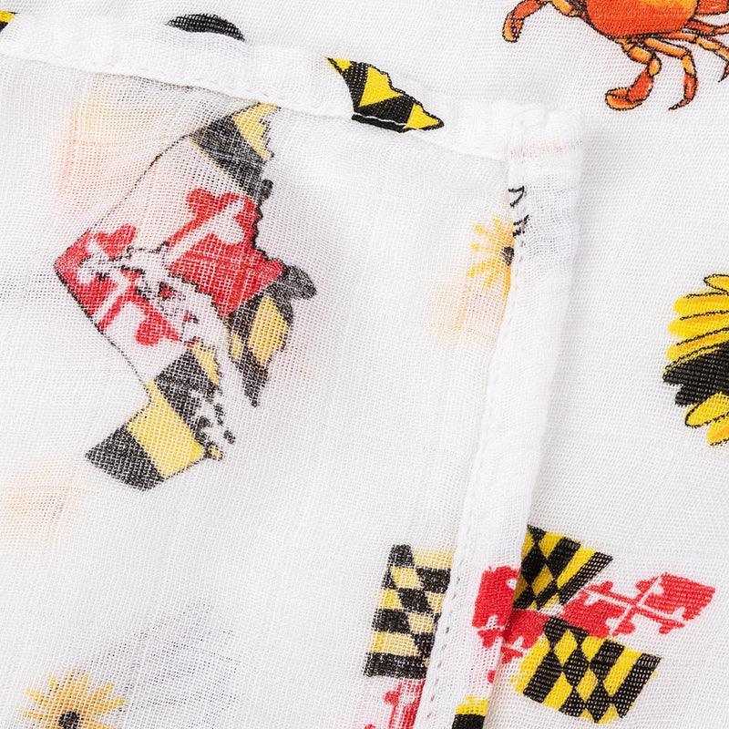 Maryland-themed baby gift set with muslin swaddle blanket and burp cloth, featuring state icons and landmarks.