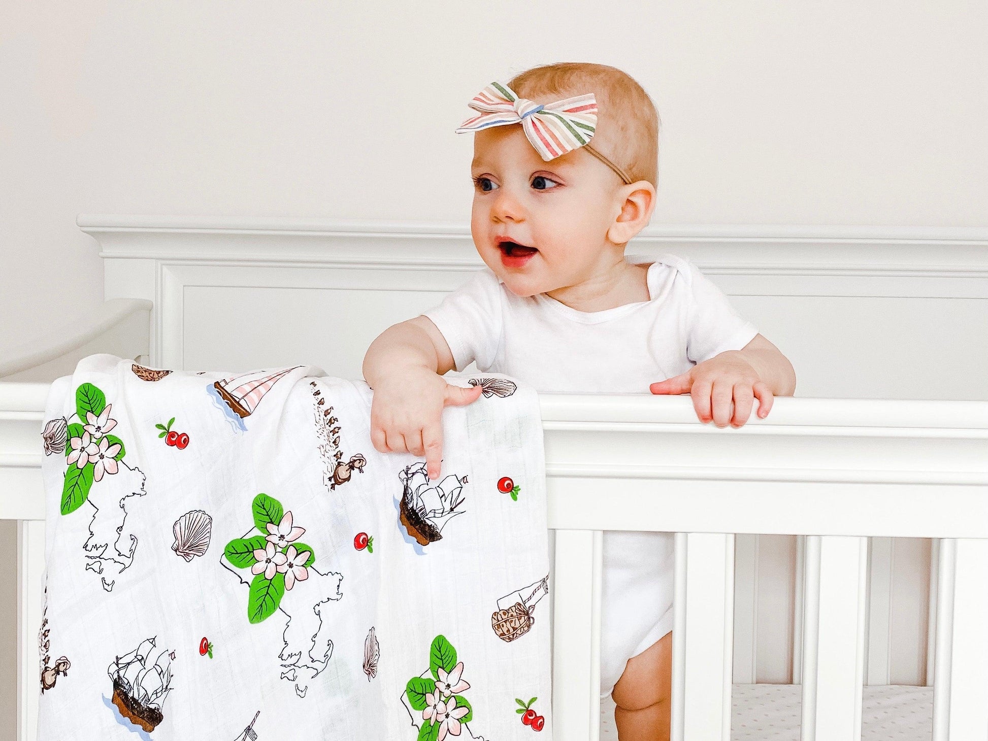 Massachusetts-themed baby gift set with floral muslin swaddle blanket and matching burp cloth/bib combo.