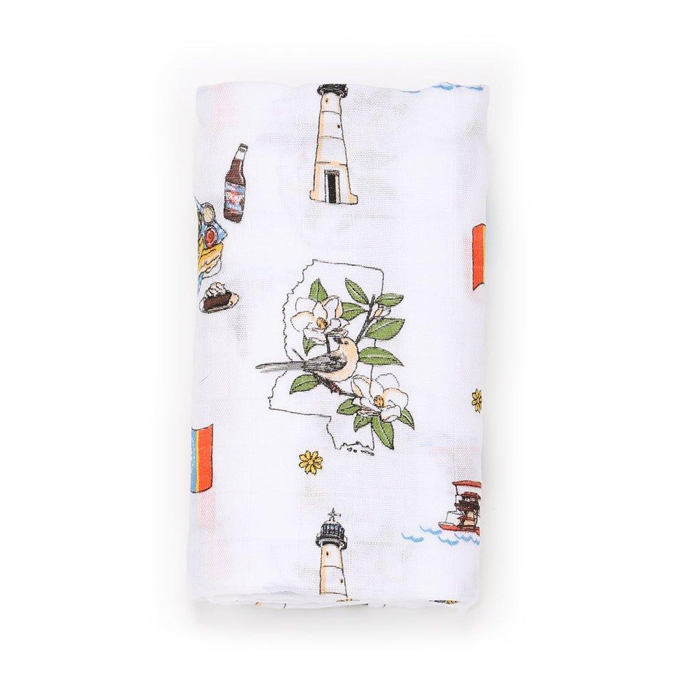 Mississippi-themed muslin swaddle and burp cloth set featuring state icons and landmarks in soft pastel colors.