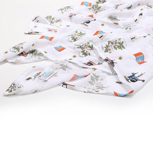 Mississippi-themed muslin swaddle and burp cloth set featuring state icons, in soft pastel colors, neatly folded.