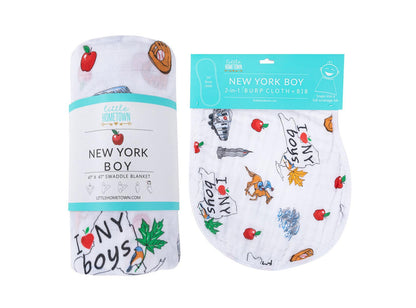 Blue and white muslin swaddle blanket and burp cloth set with New York-themed illustrations for baby boys.