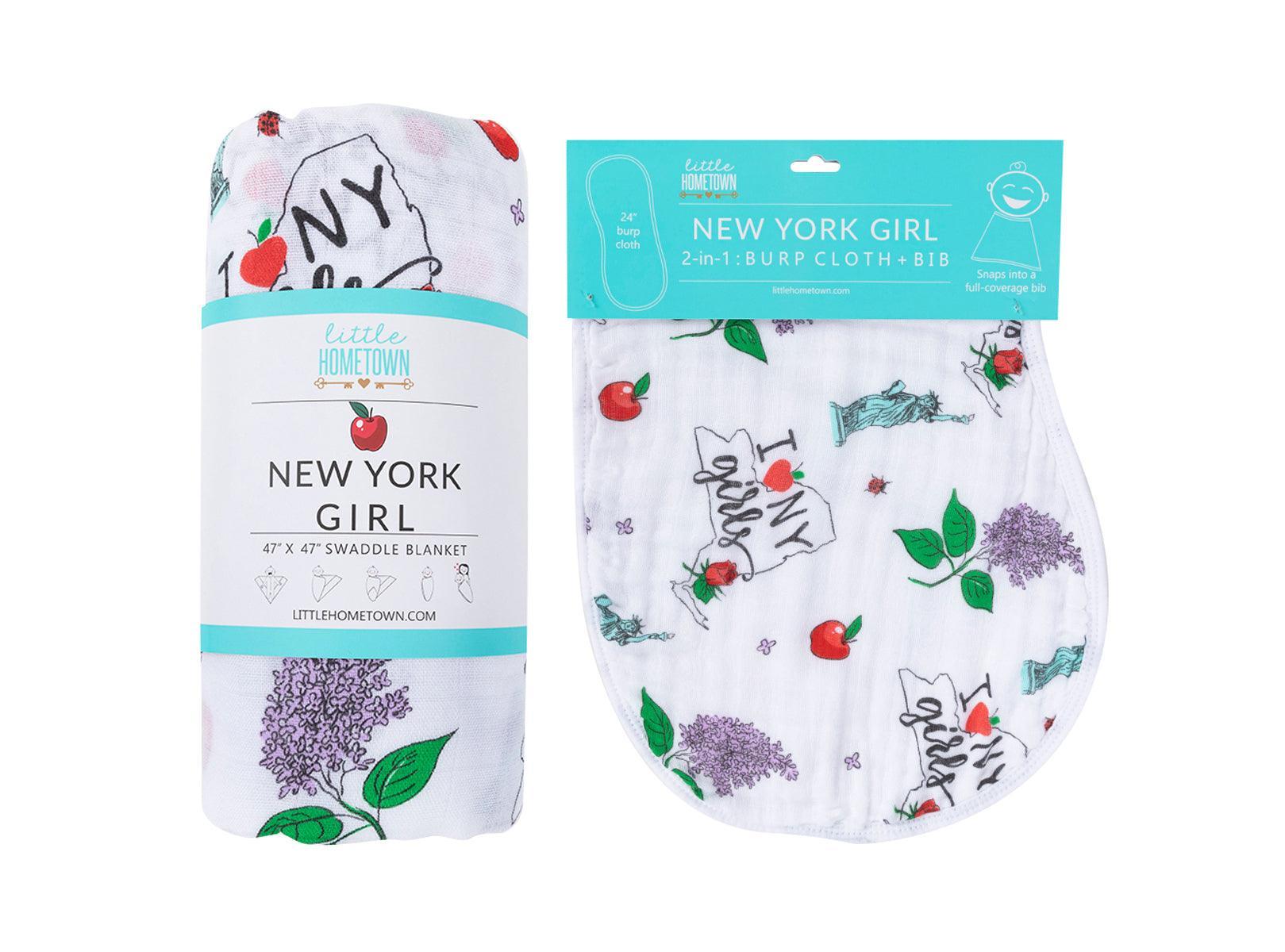 New York-themed baby gift set with muslin swaddle blanket and burp cloth, featuring iconic city landmarks.