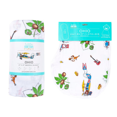 The Ohio burp cloth and bib combo photographed beside its matching rolled swaddle, ready to give.