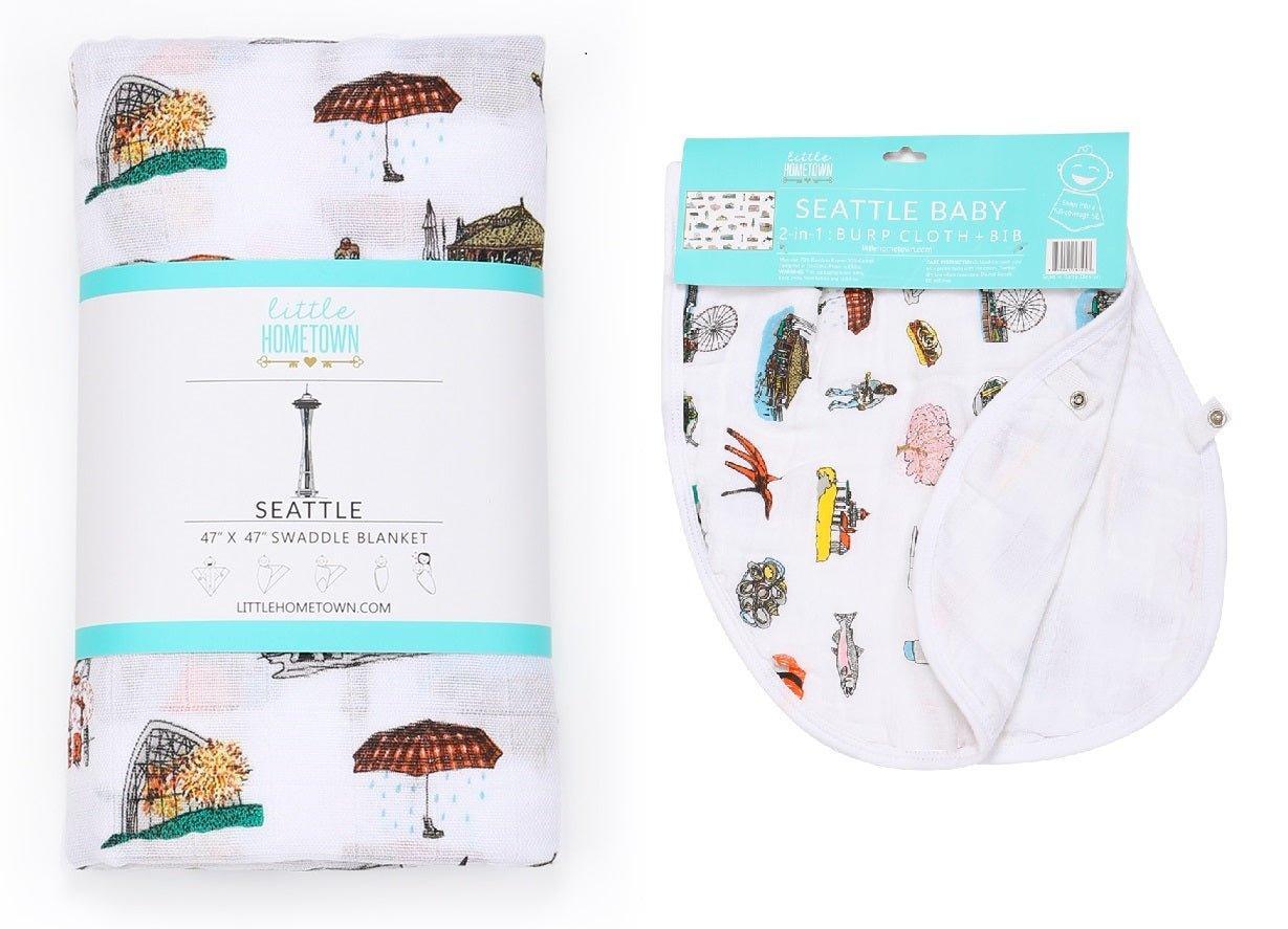 Seattle-themed baby gift set with muslin swaddle blanket and burp cloth/bib combo, featuring iconic city landmarks.