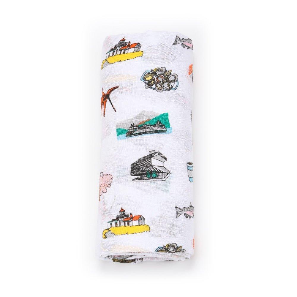 Seattle-themed baby gift set with muslin swaddle blanket and burp cloth/bib combo, featuring city icons.