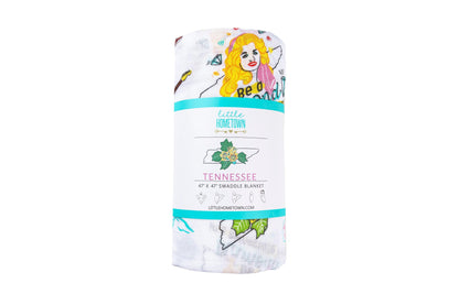 Floral-themed muslin swaddle blanket and burp cloth set, featuring delicate pink and green flower patterns.