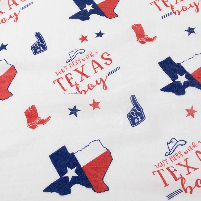 Texas-themed baby gift set with muslin swaddle blanket, burp cloth, and bib featuring state icons and text.