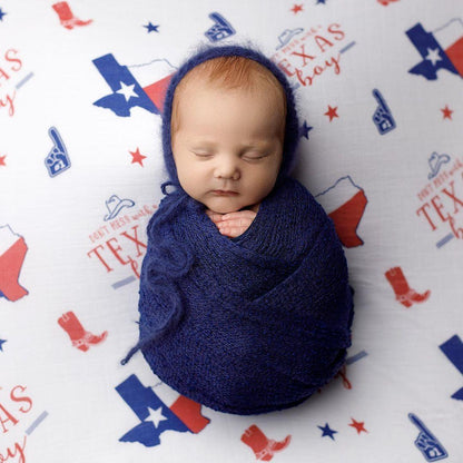 Texas-themed baby gift set with a muslin swaddle blanket and burp cloth, featuring state icons and "Little Hometown" text.