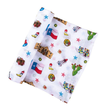 Texas-themed baby gift set with a muslin swaddle blanket and burp cloth/bib combo, featuring state icons.