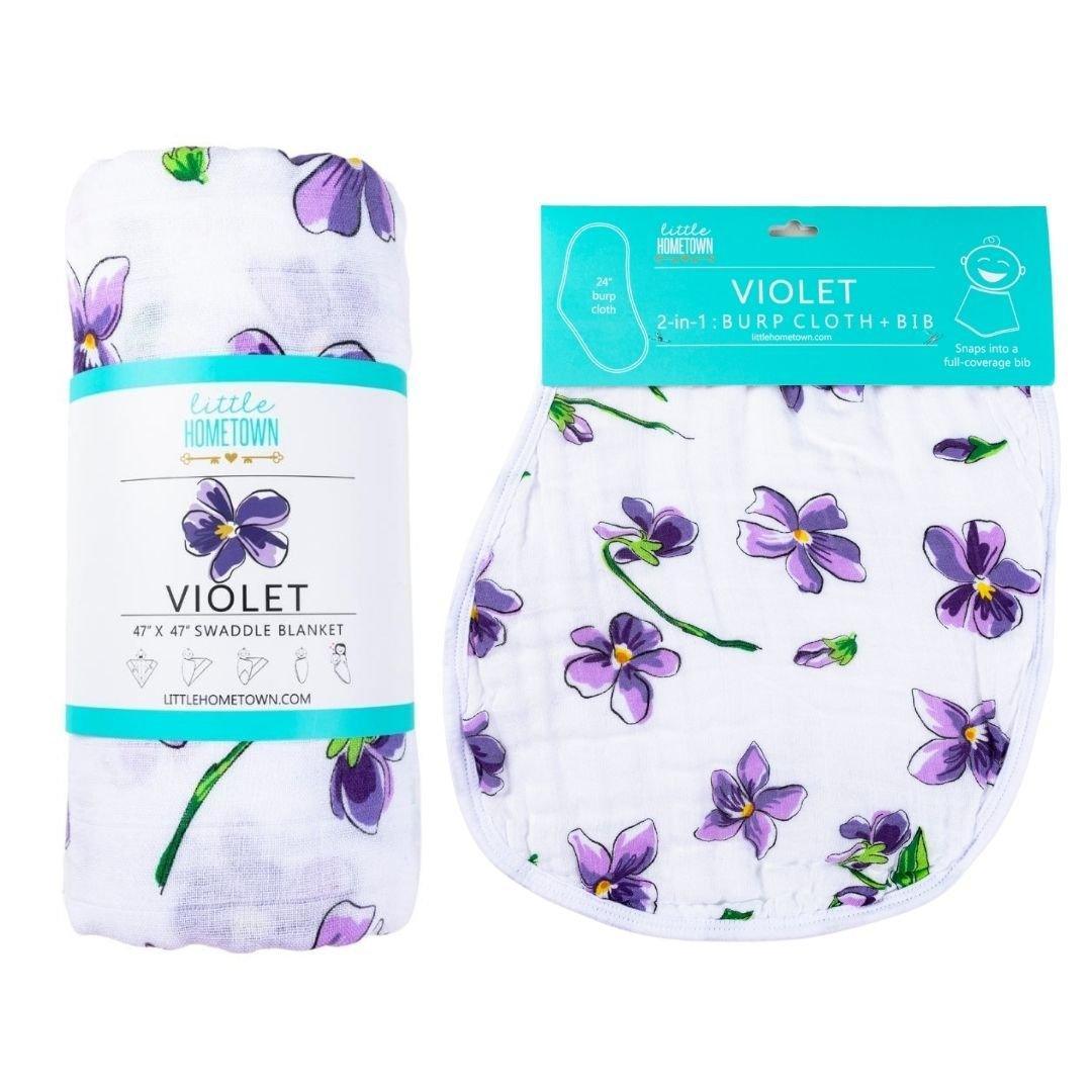 Soft violet baby muslin swaddle blanket and burp cloth/bib combo set, neatly folded on a white background.