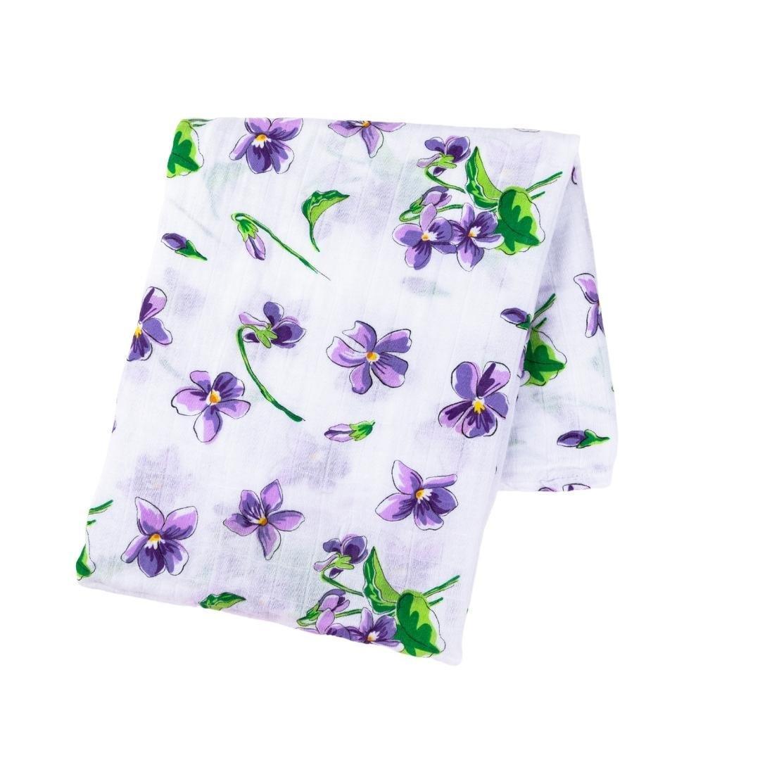Violet baby muslin swaddle blanket and burp cloth/bib combo set with delicate white floral patterns.