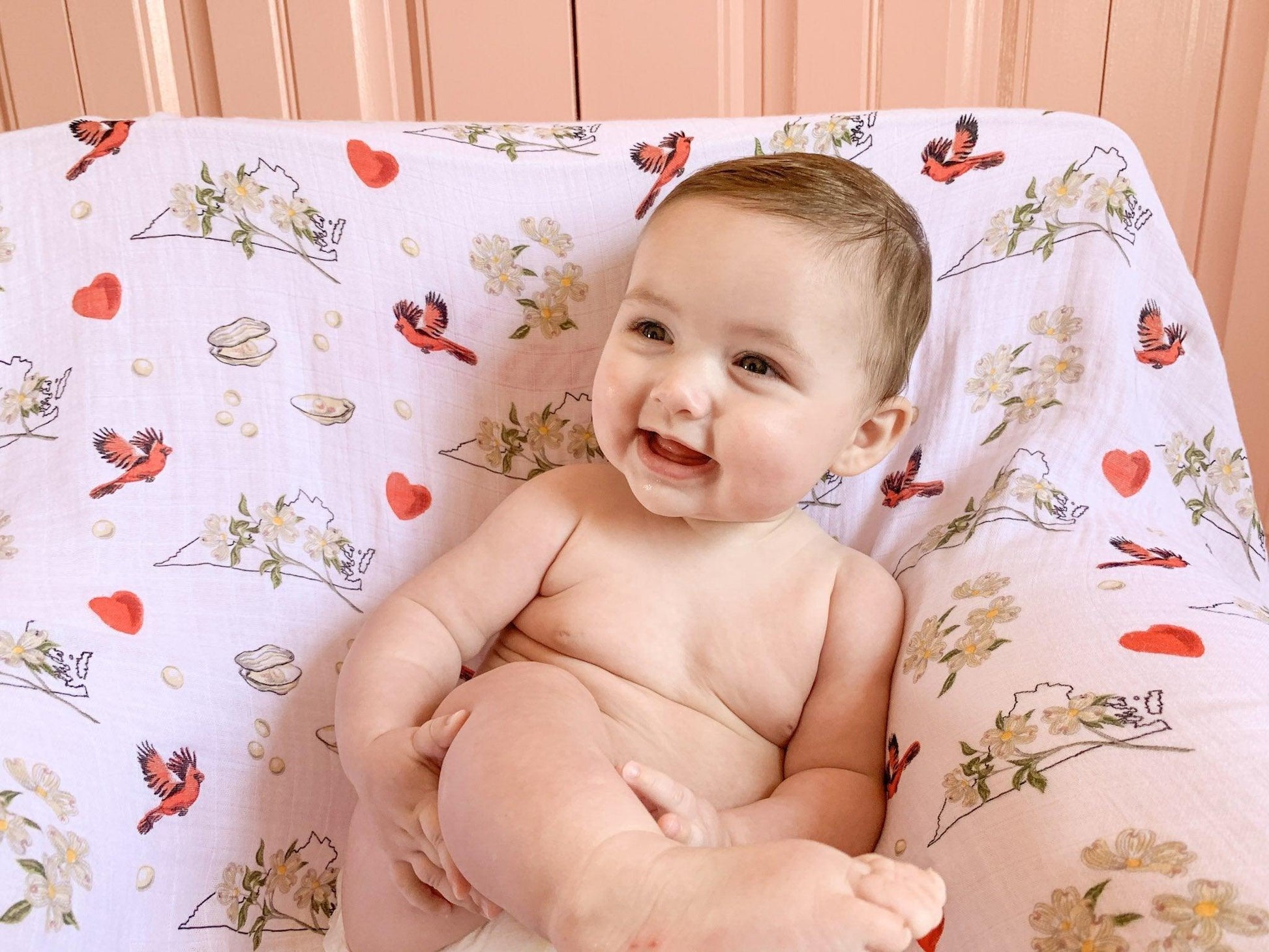 Floral-themed baby muslin swaddle blanket and burp cloth set, featuring delicate pink and green flower patterns.