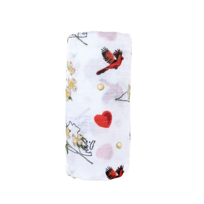 Floral-themed muslin swaddle blanket and burp cloth set, featuring delicate pink and green flower patterns.