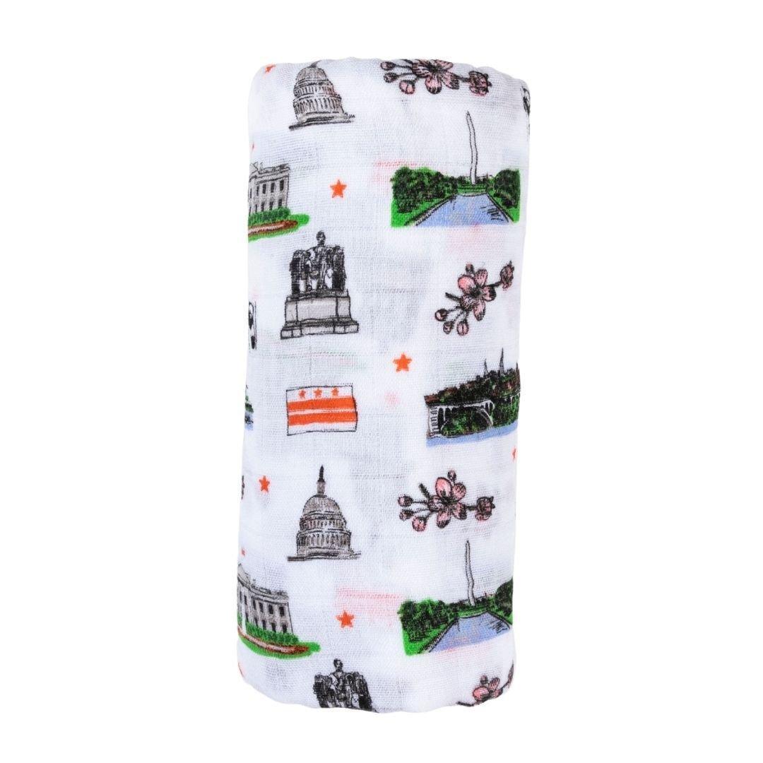 Washington D.C. baby gift set with muslin swaddle blanket and burp cloth, featuring iconic landmarks and symbols.