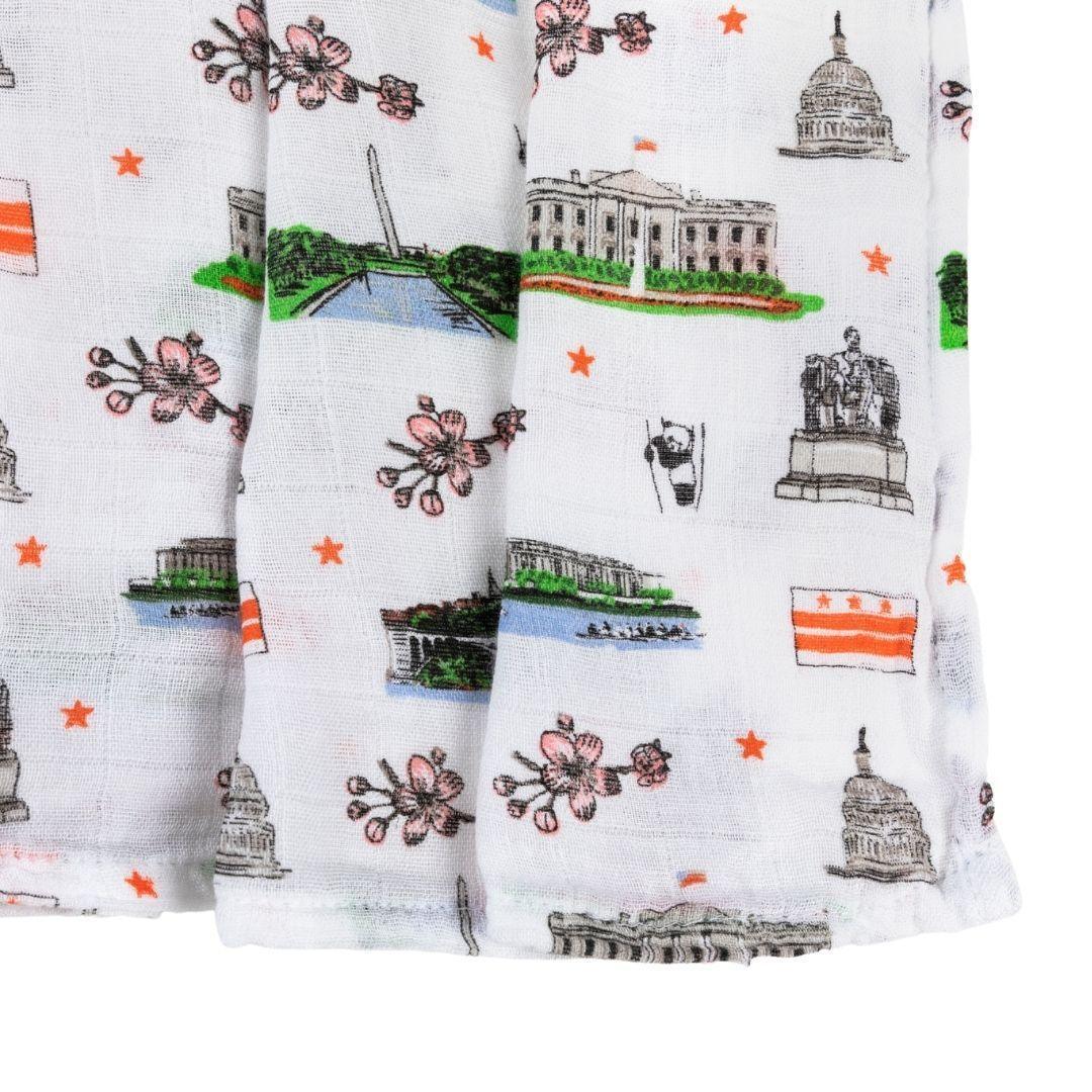 Washington D.C. baby gift set with muslin swaddle blanket and burp cloth, featuring iconic city landmarks.