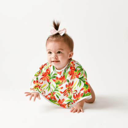 Prairie Fire baby muslin swaddle blanket and burp cloth set with vibrant floral design on a white background.