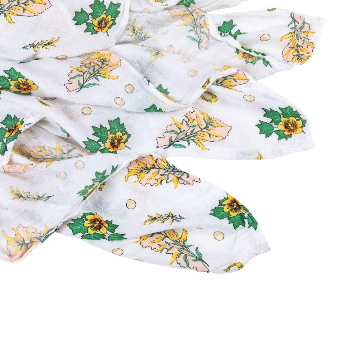 Soft muslin swaddle blanket with a delicate floral pattern in pastel colors, featuring "Kentucky Baby" text.