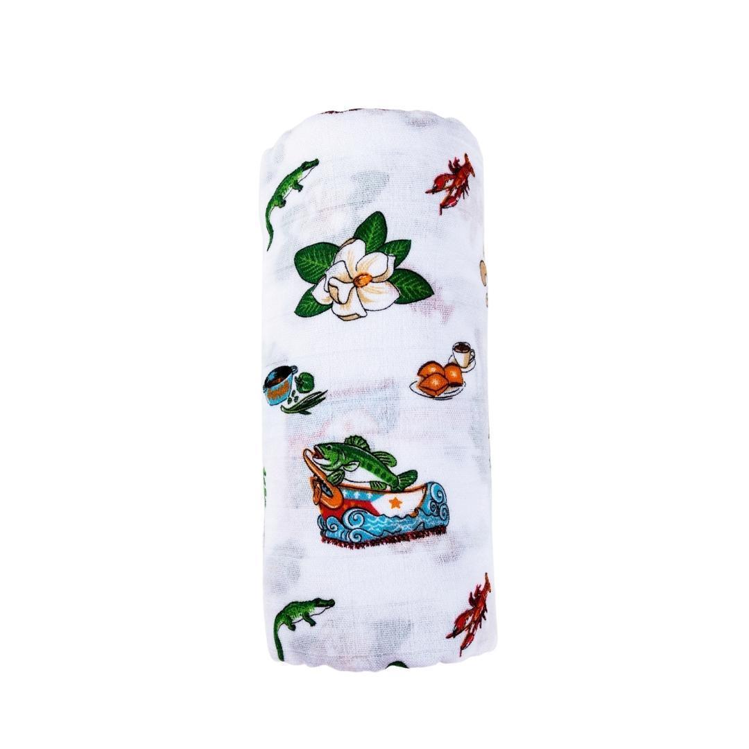 Louisiana-themed baby muslin swaddle blanket with state icons like crawfish, pelican, and magnolia on a white background.