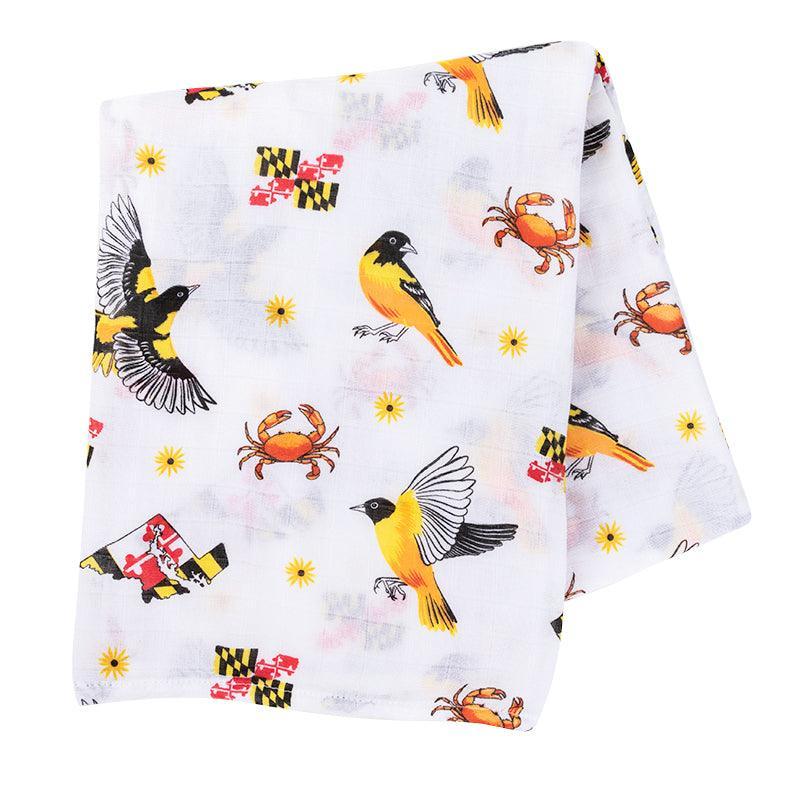 White muslin swaddle blanket with Maryland-themed illustrations, including crabs, lighthouses, and state symbols.