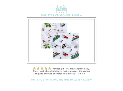 Massachusetts-themed baby muslin swaddle blanket with state icons like lobsters, lighthouses, and sailboats.