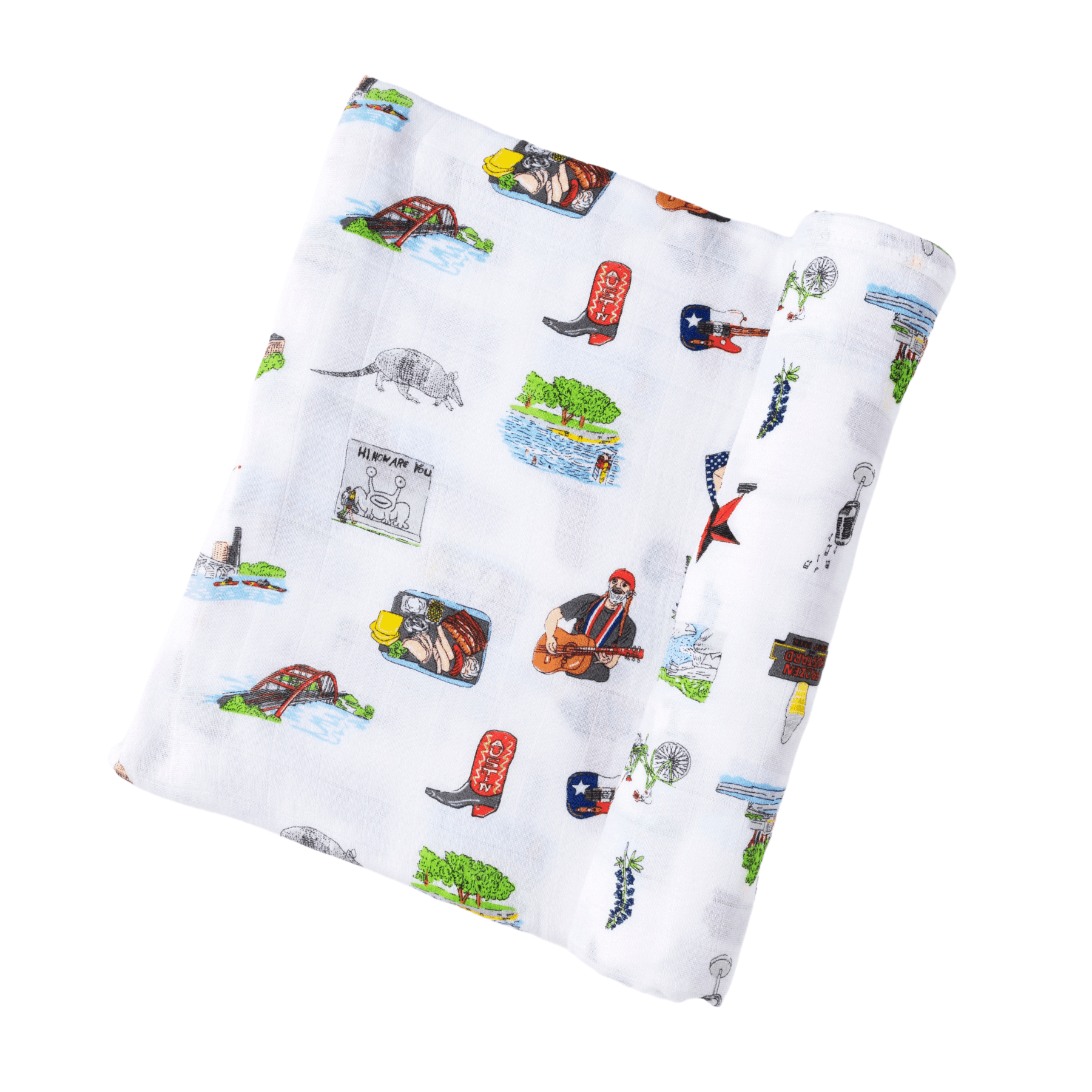 White muslin swaddle blanket with colorful Austin-themed illustrations, including landmarks and icons, on a white background.