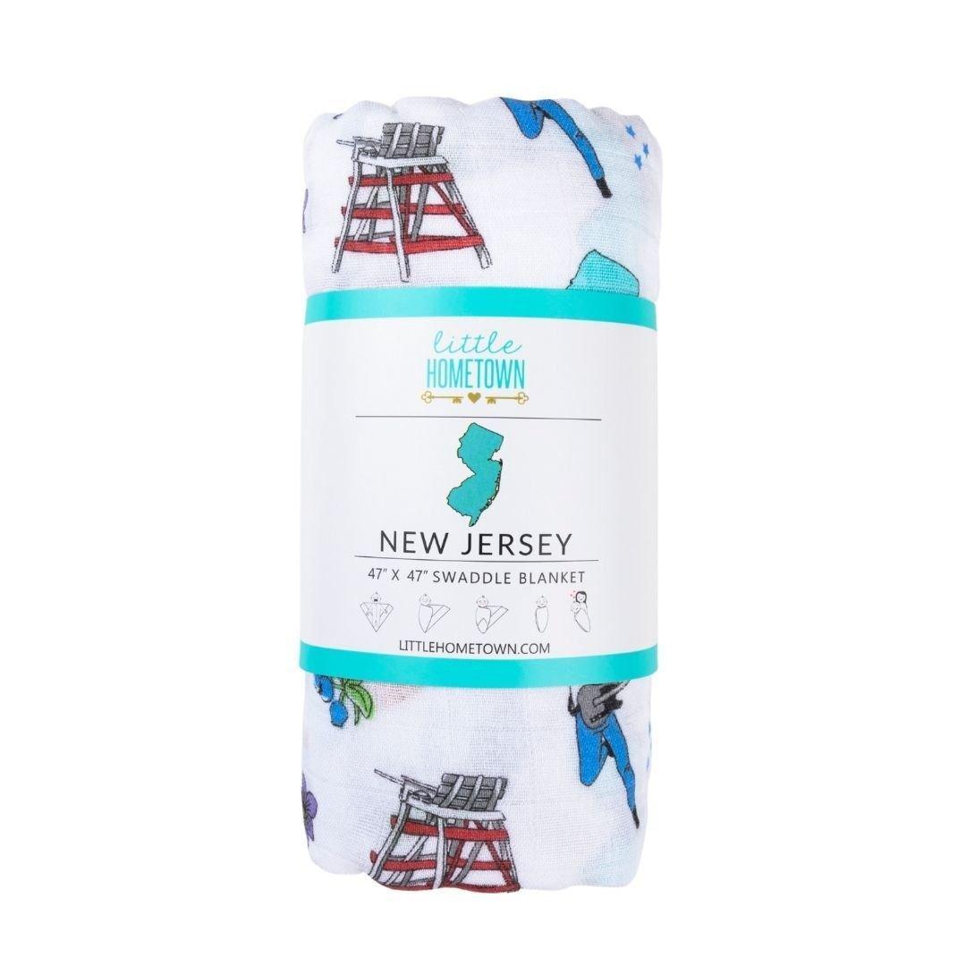 New Jersey-themed baby muslin swaddle blanket with state icons and landmarks in soft pastel colors.