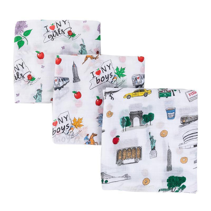 New York-themed baby boy muslin swaddle blanket featuring iconic landmarks and symbols in soft pastel colors.