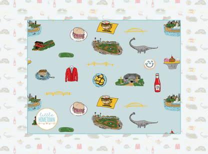 Pittsburgh-themed plush throw blanket with iconic city landmarks in vibrant colors, measuring 60x80 inches.